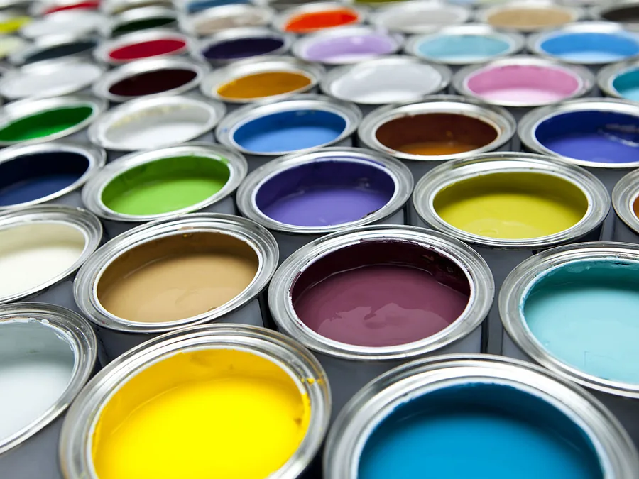 Cans of wall paint in many shades